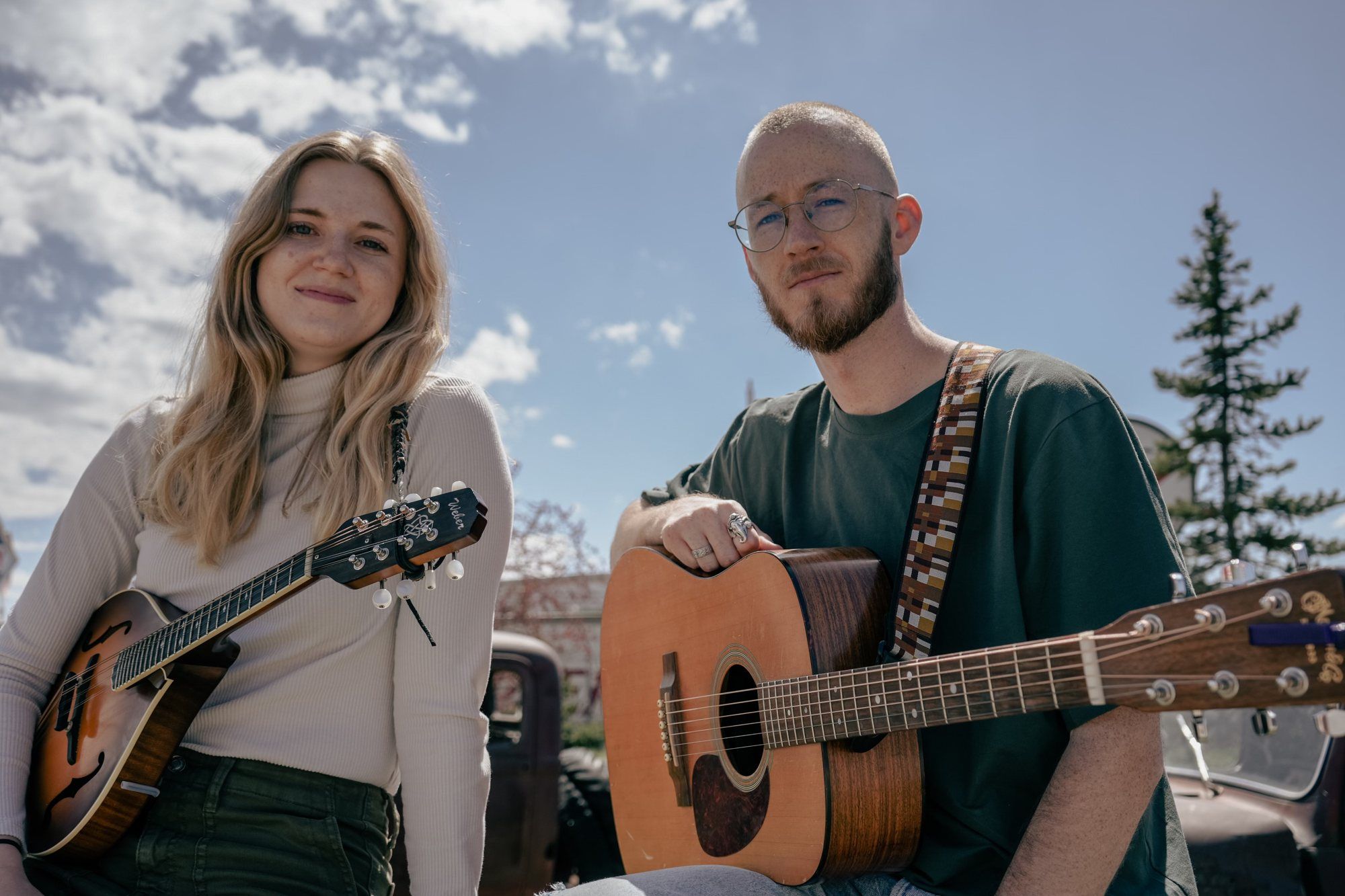 Stomping Cactus: Brielle Petrie with a mandolin and Isaac Geslison with a guitar